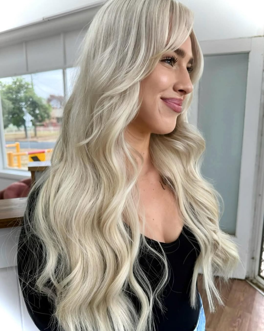 Long vanilla blonde hair extensions styled by Platinum Hair Extensions in Adelaide